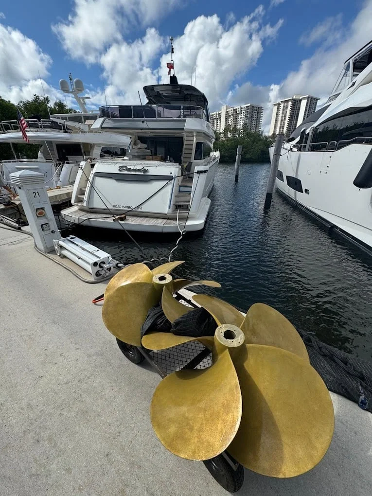Propellers dockside beside yachts